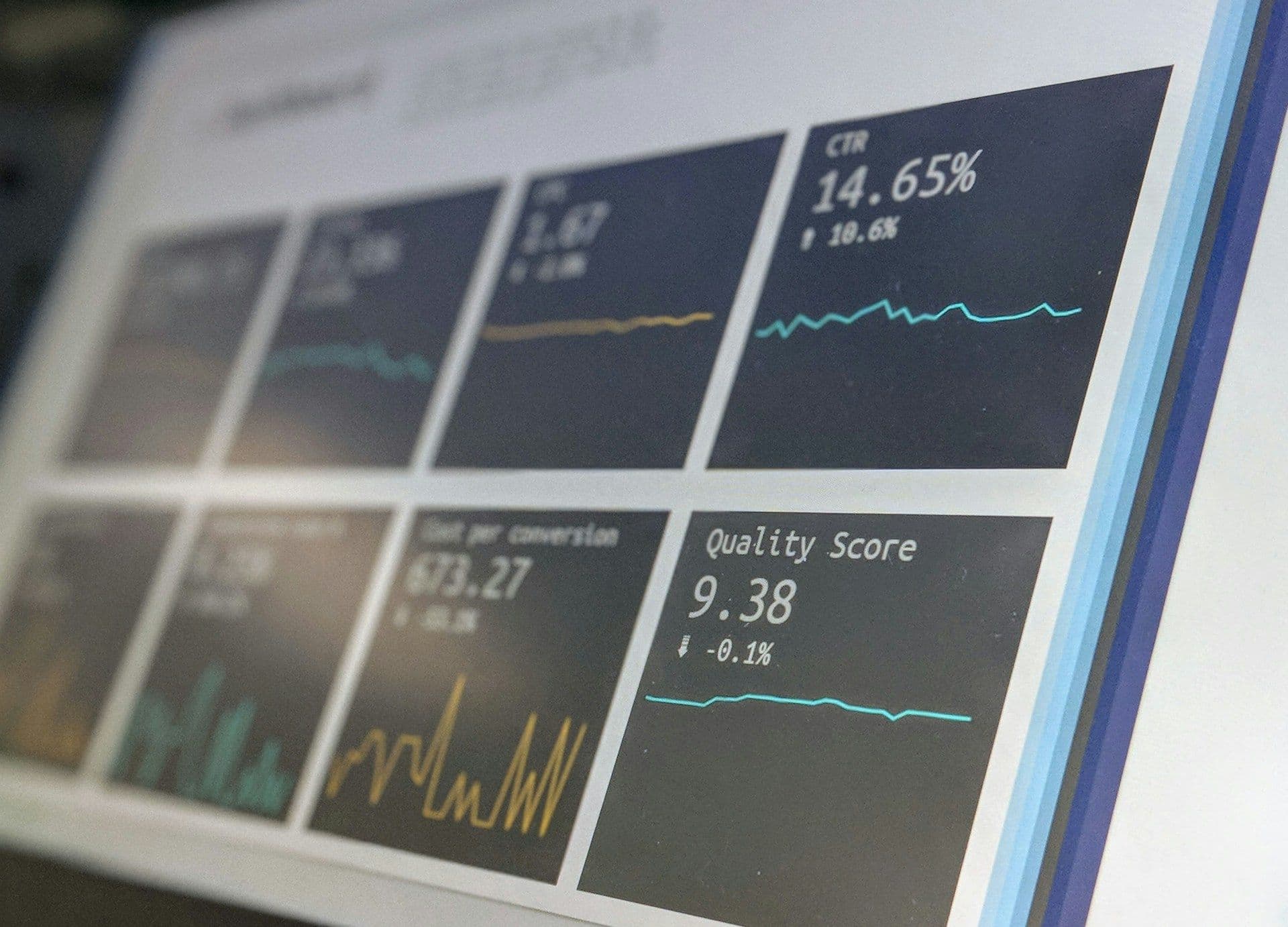 Business analyst comparing data on two screens
