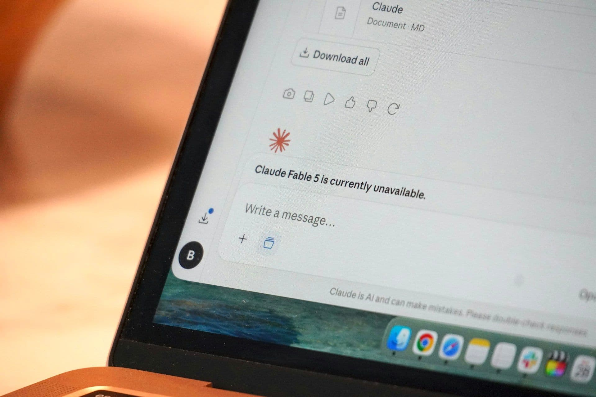 Close-up of a laptop screen showing the Claude AI chat interface