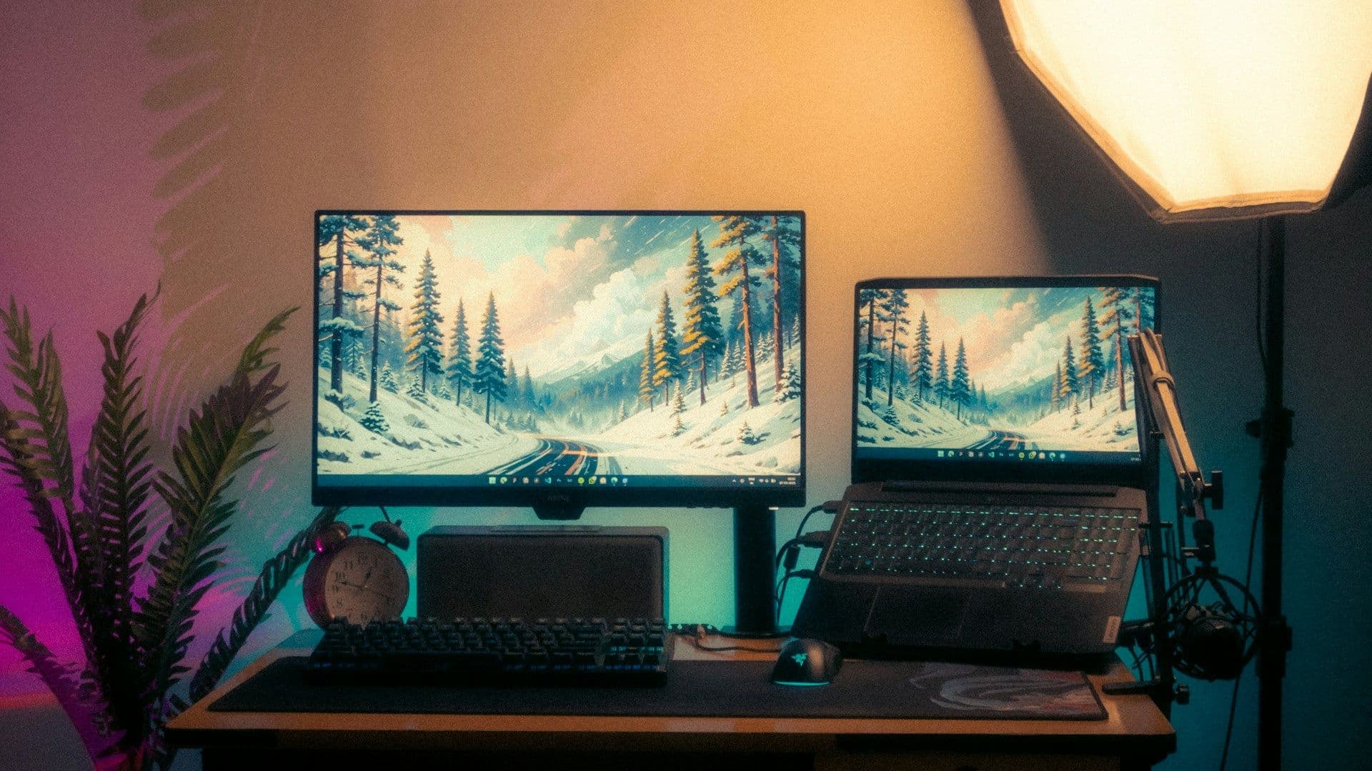 Two laptops side by side comparing AI tools for bookkeeping