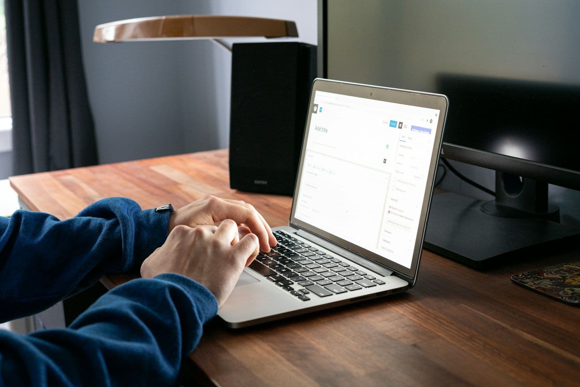 Bookkeeper following a workflow tutorial at a desk