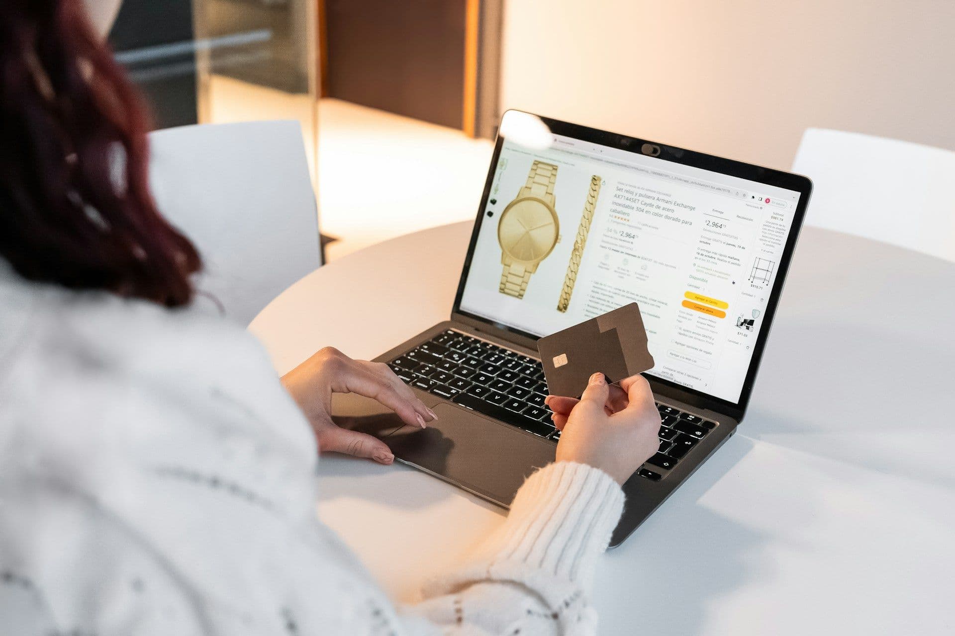 Ecommerce merchant reviewing Shopify payouts on laptop